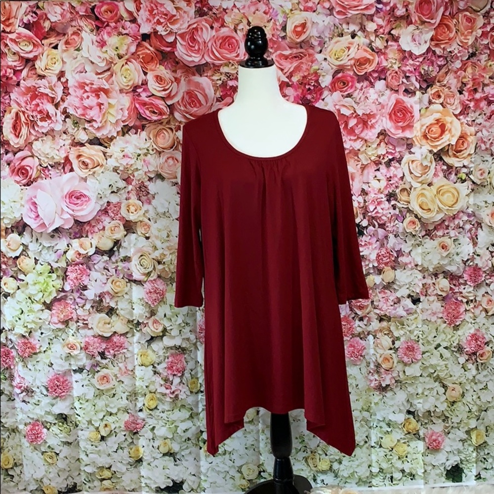 Burgundy tunic length, longer on sides & sleeves.